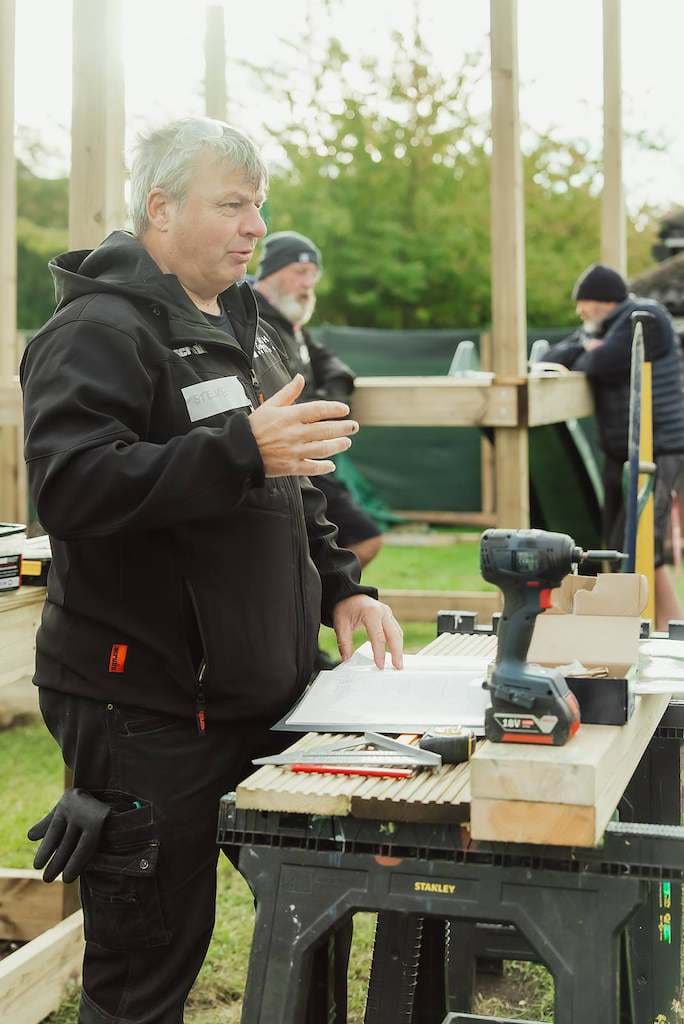 A volunteer working on timber for MAIN’s new outdoor play area